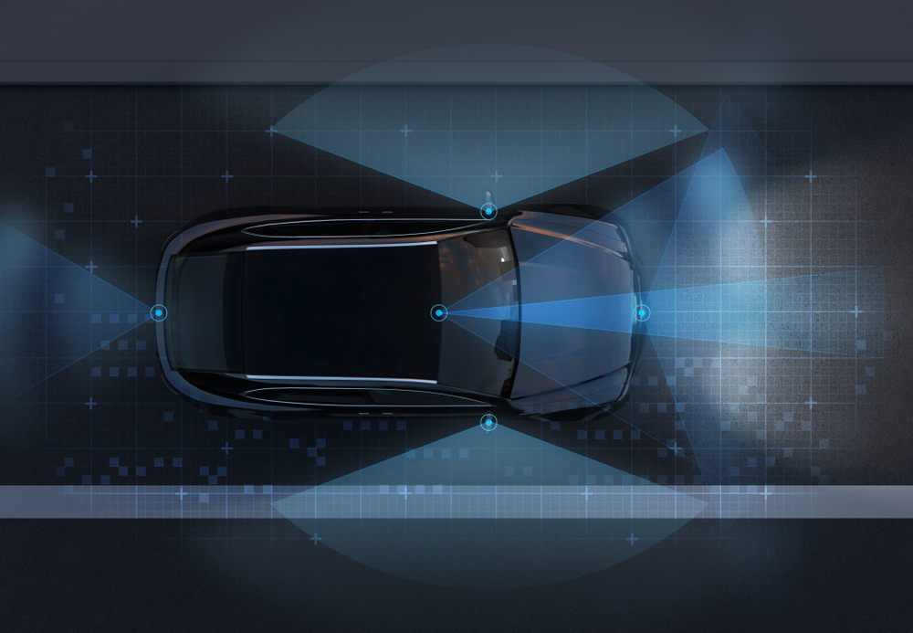 A rendering of an autonomous car with sensors shining light in front, on the sides, and behind the car.