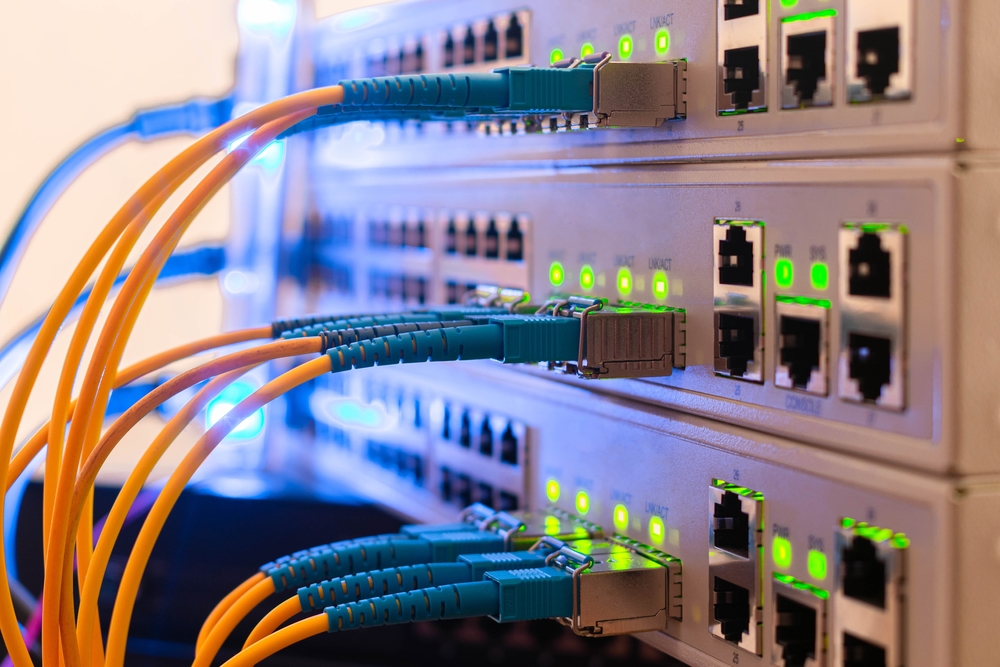 Inneos | Video Over Fiber Makes the Difference in Industrial Environments Fiber cables plugged into a control panel.